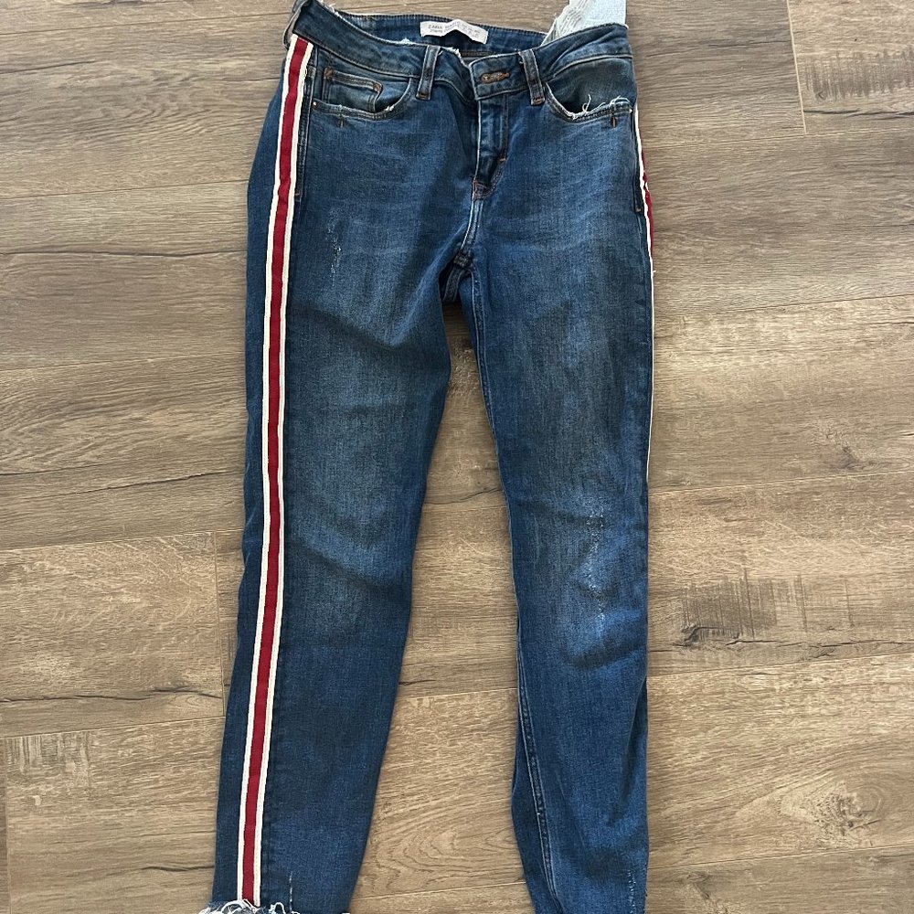 Skinny denim jeans with red and white stripe down leg. Size 2.